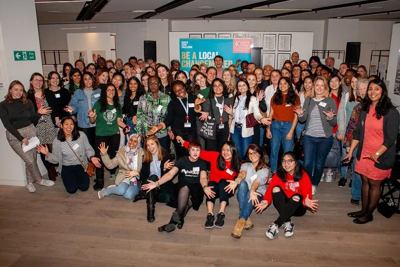 King's Changemakers - happy pose group photo with outstretched arms