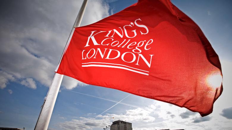A red flag with the King's College London logo