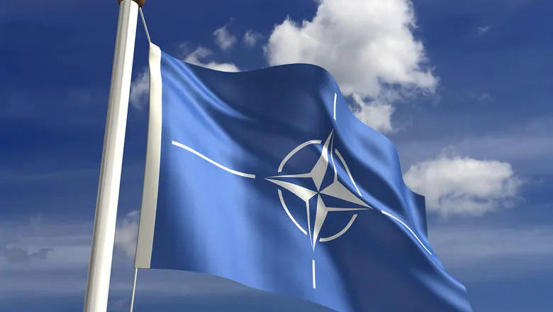 NATO flag against blue skies