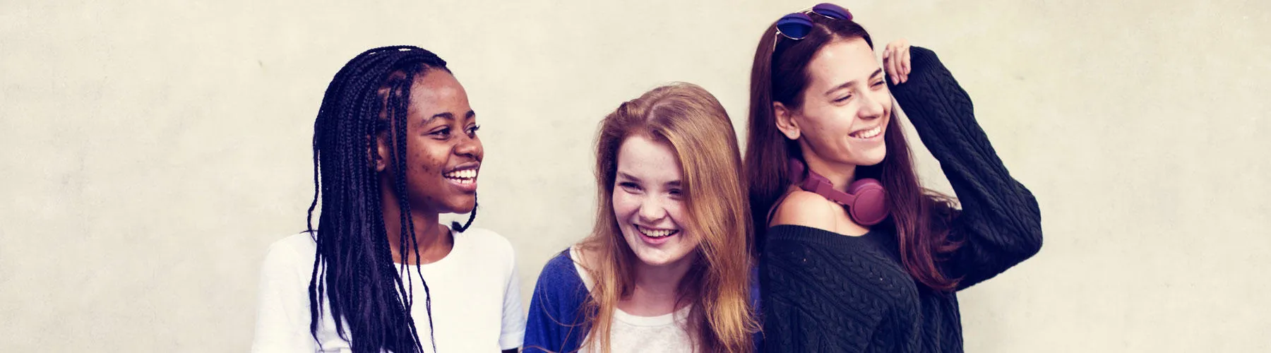 Three teenage girls standing together