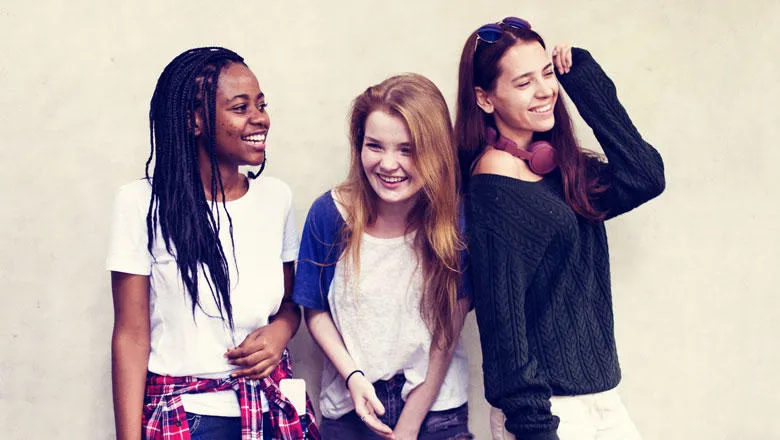 Three teenage girls standing together