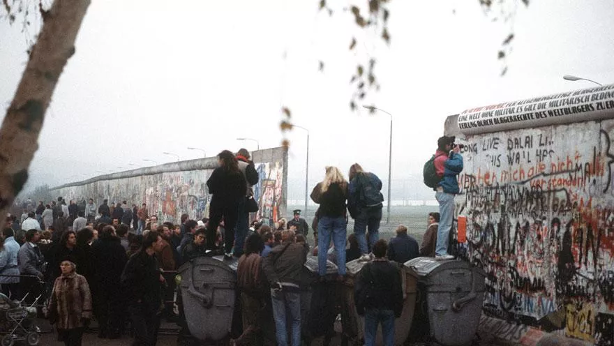 West German citizens gather at a newly created opening in the Berlin Wall at Potsdamer Platz in November 1989