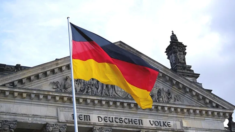 German flag flies in front of the Reichstag Building, Berlin