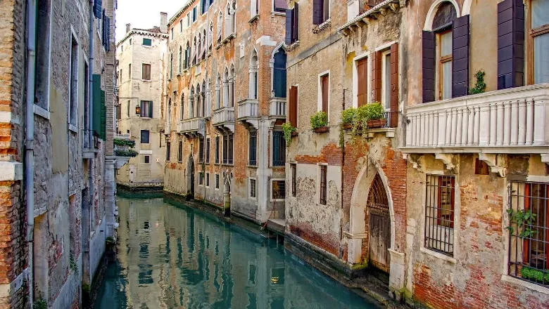 Italian canal lined by buildings.