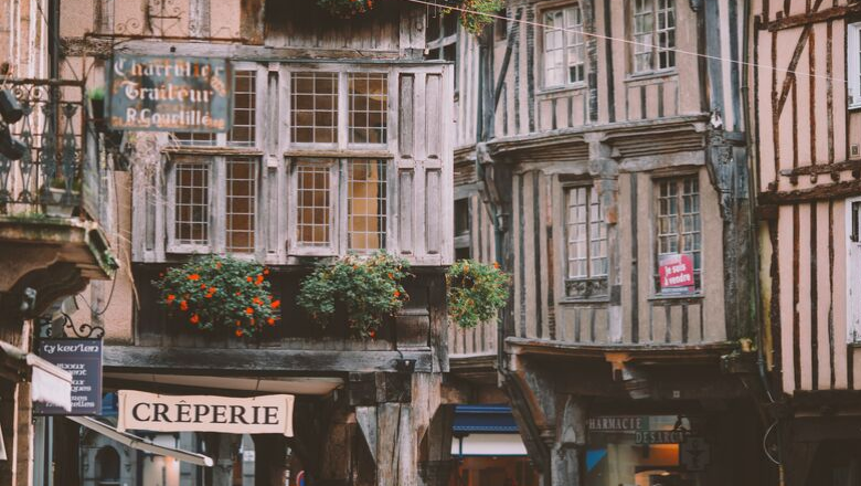 Quaint French buildings with "Creperie" sign