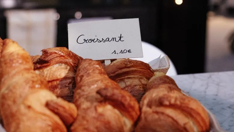 Basket of croissants and a label with price of £1.10