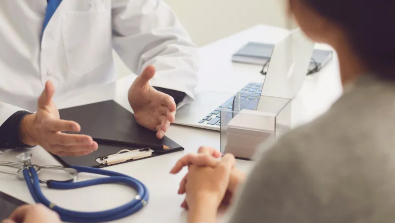 Doctor and patient in a clinical setting (Image credit: Canva)
