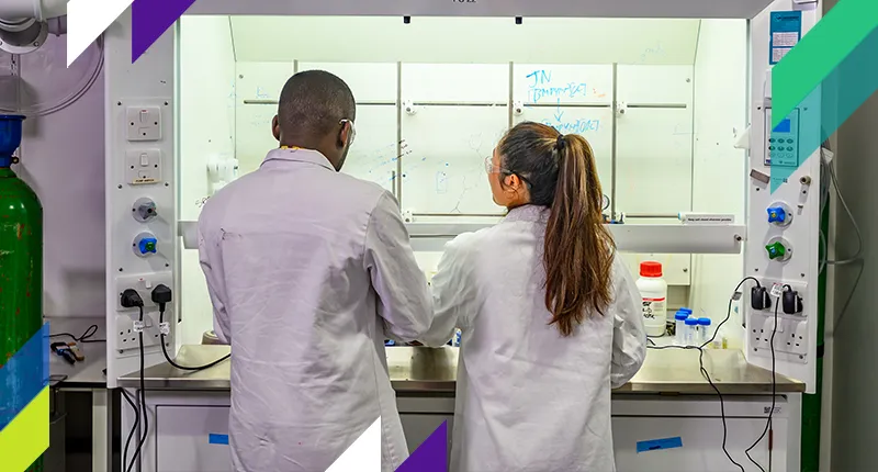 Two Scientists Working in Lab