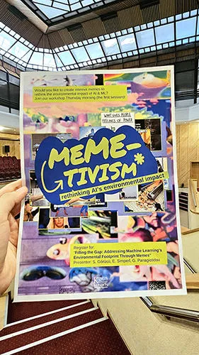A 'Meme-tivism' flyer in a a hand