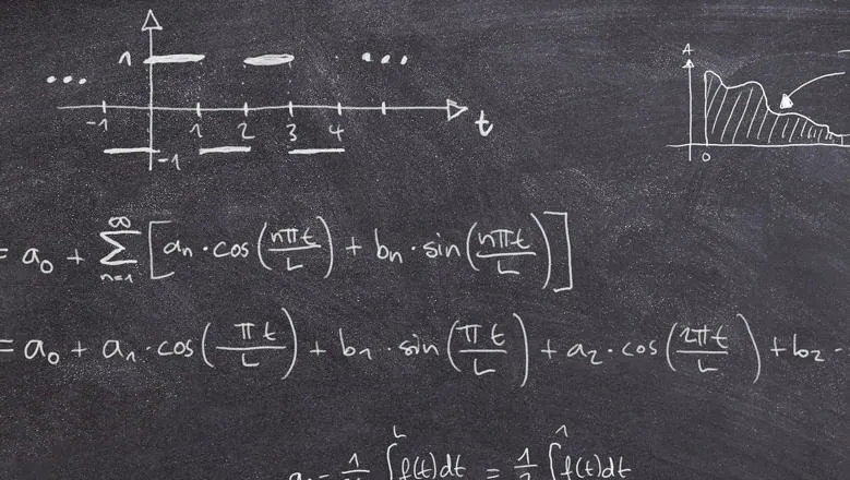 Equations and graphs on a chalkboard