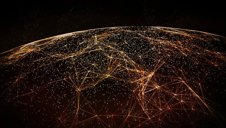 Black globe with orange networks connecting over the surface
