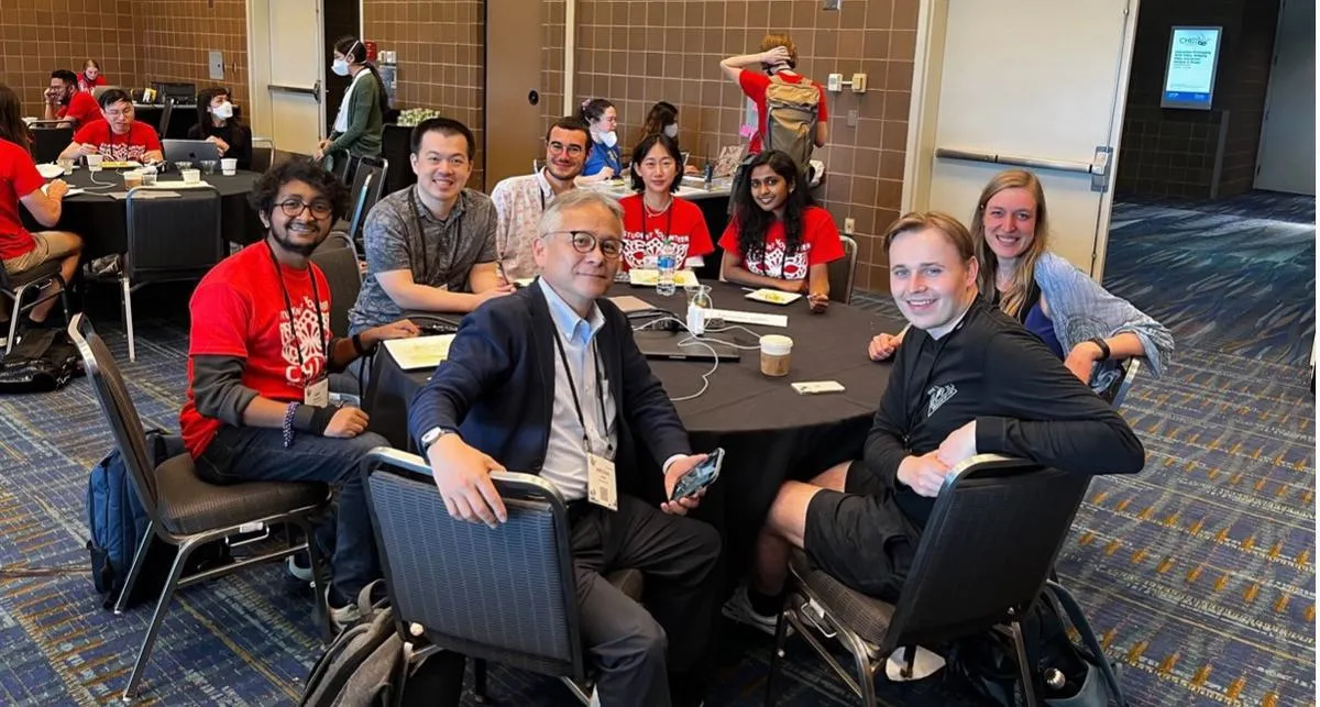 PhD student Humphrey Curtis, front left, with Hiroshi Ishii (MIT Media Lab Professor and a leader in tangible computing), front right, with other SVS.