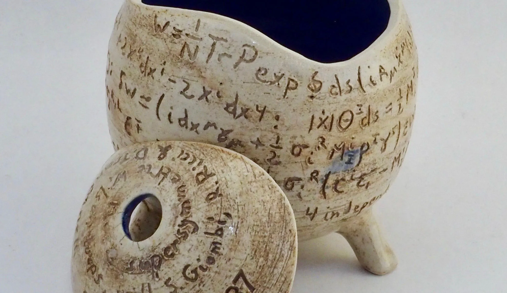 Ceramic with mathematical symbols on it