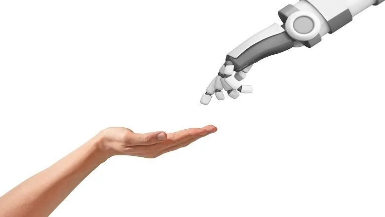 image of a human hand  with open palm meeting a robot hand