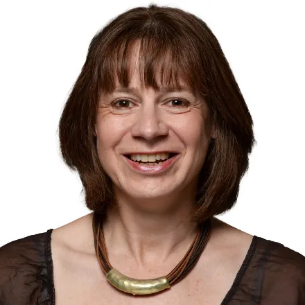 A photo of Professor Dawn Bonfield looking direct at the camera and smiling, on a white background