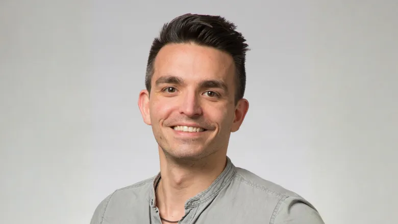 Dr Michael Bertaume smiling and facing the camera