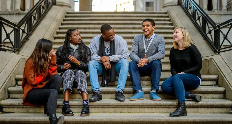 students talking stairs