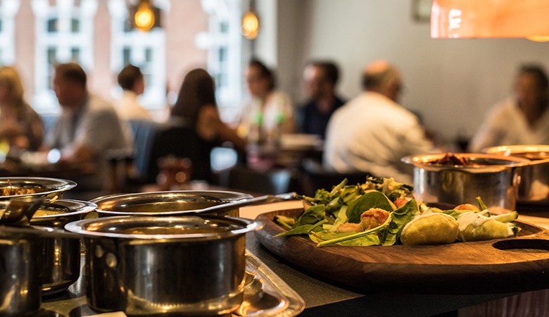 Restaurant buffet with people in background