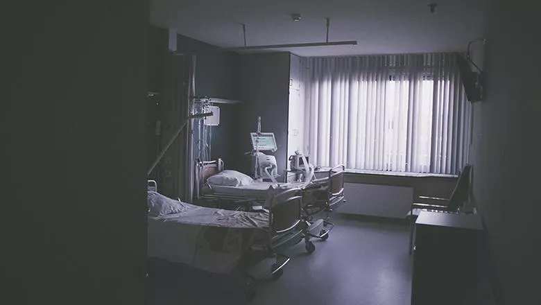 Empty hospital beds on a ward. Photo by Daan Stevens on Unsplash