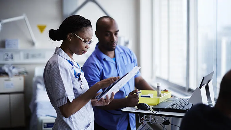 Ward nurse checking paper work