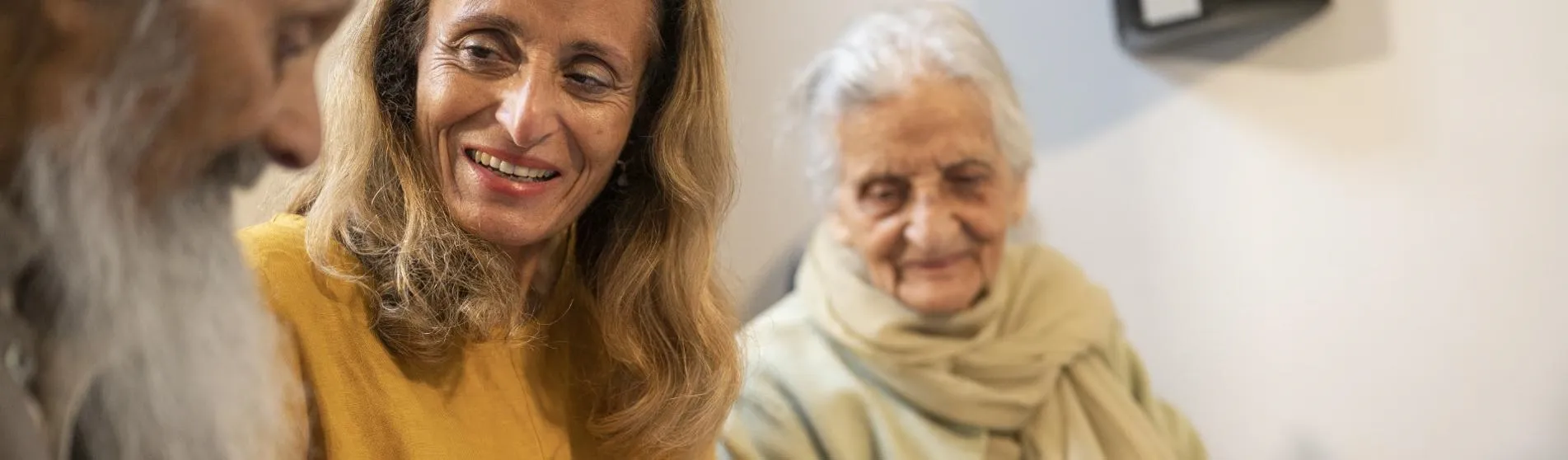 older couple visited by woman social care