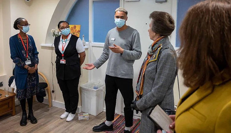(L-R) Lecturer Jennifer Kalitsi and Children's Nursing students Marian Okyere-Darkoh and Kofi Morris Heather with The Princess Royal and Catherine Tann, Head of Simulation Operations in the simulated home environment.