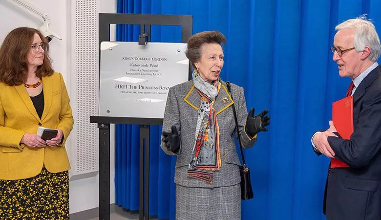 Princess Anne and two people standing in front of a plaque for an official opening