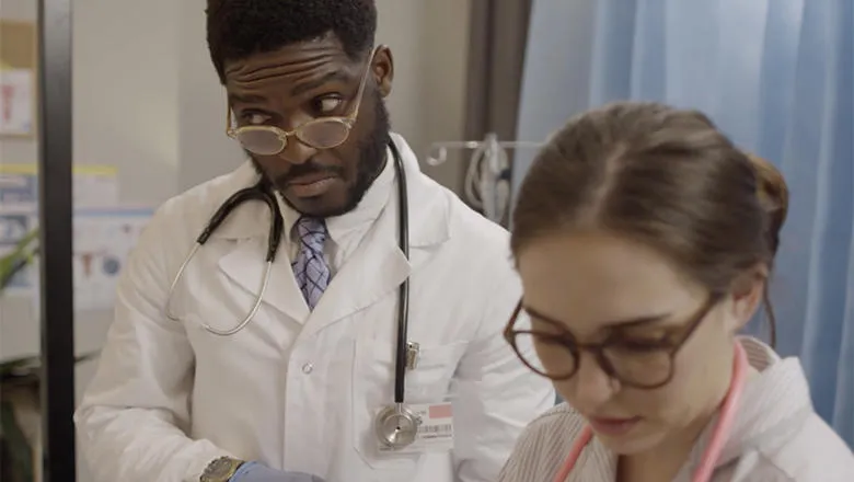 Doctor and midwife observing patients