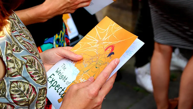 Person holding a comic book