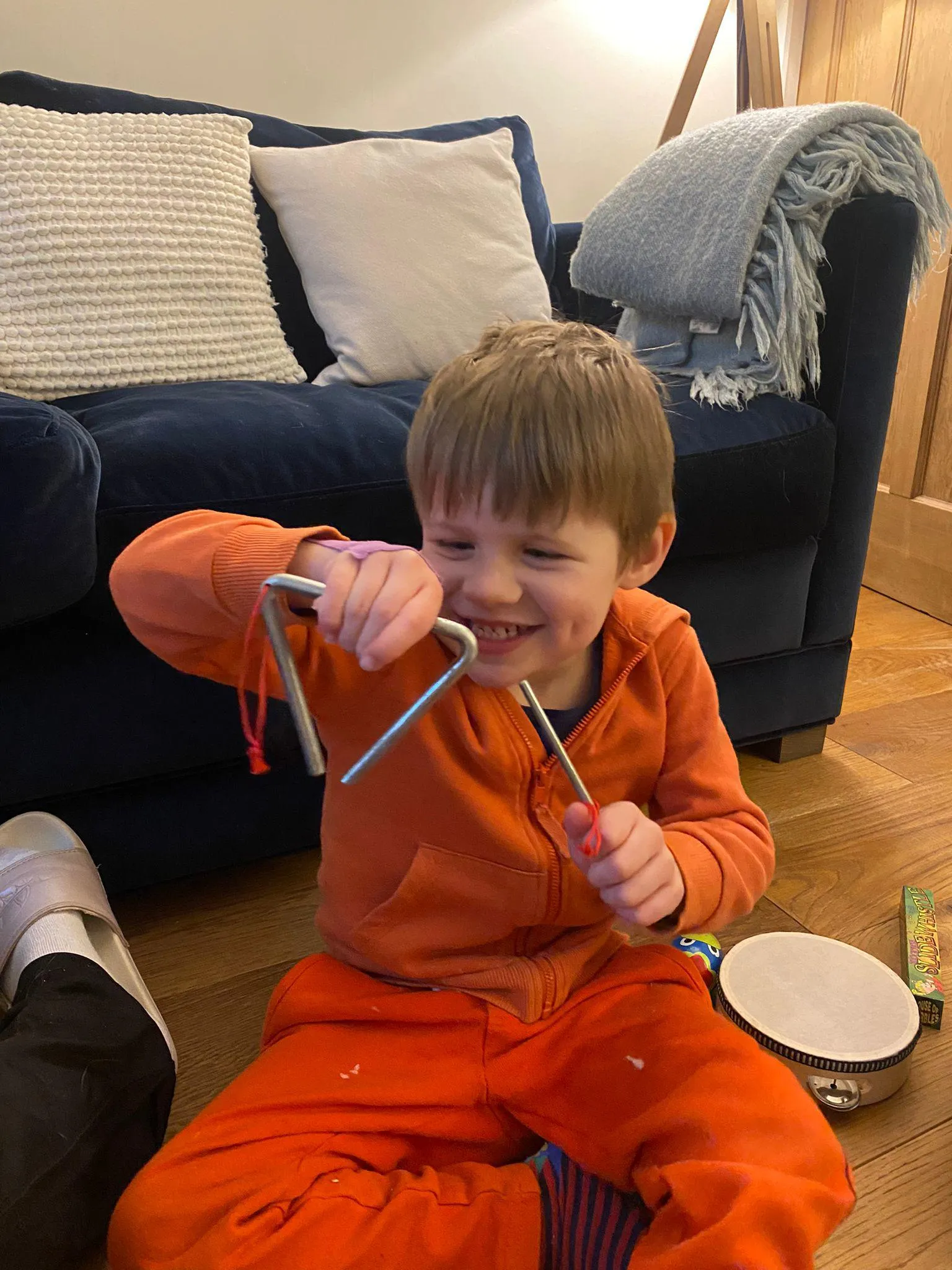 Child with hemiplegia doing upper limb rehabilitation at home