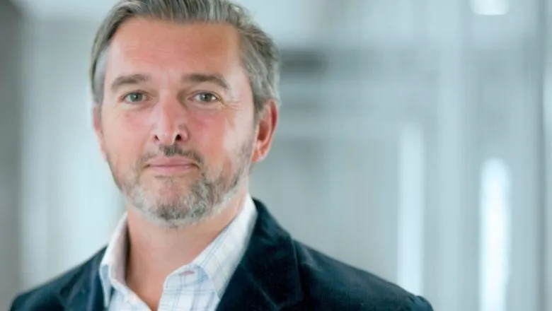 Professor Dan Hunter, wearing a shirt and jacket, looking directly to camera.