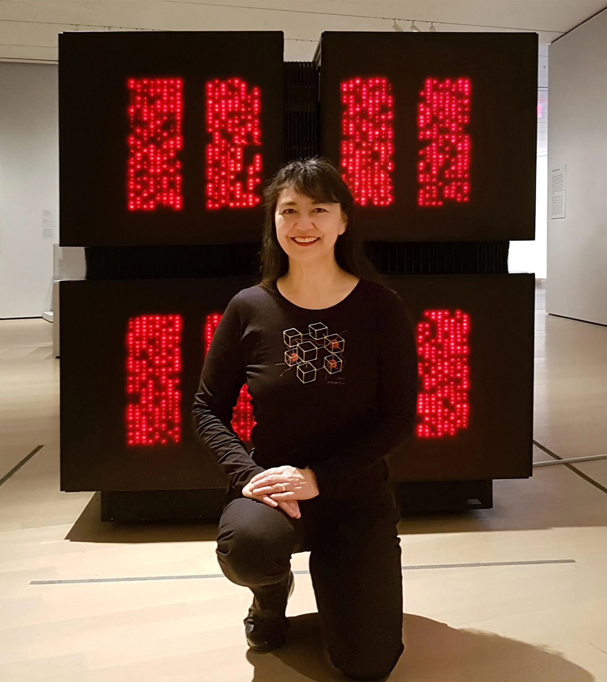 Tamiko Thiel pictured standing next to the CM-2 machine (1987).