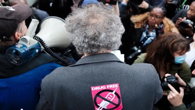 Back of man in press pack. Image-Ehimetalor Akhere Unuabona/Unsplash