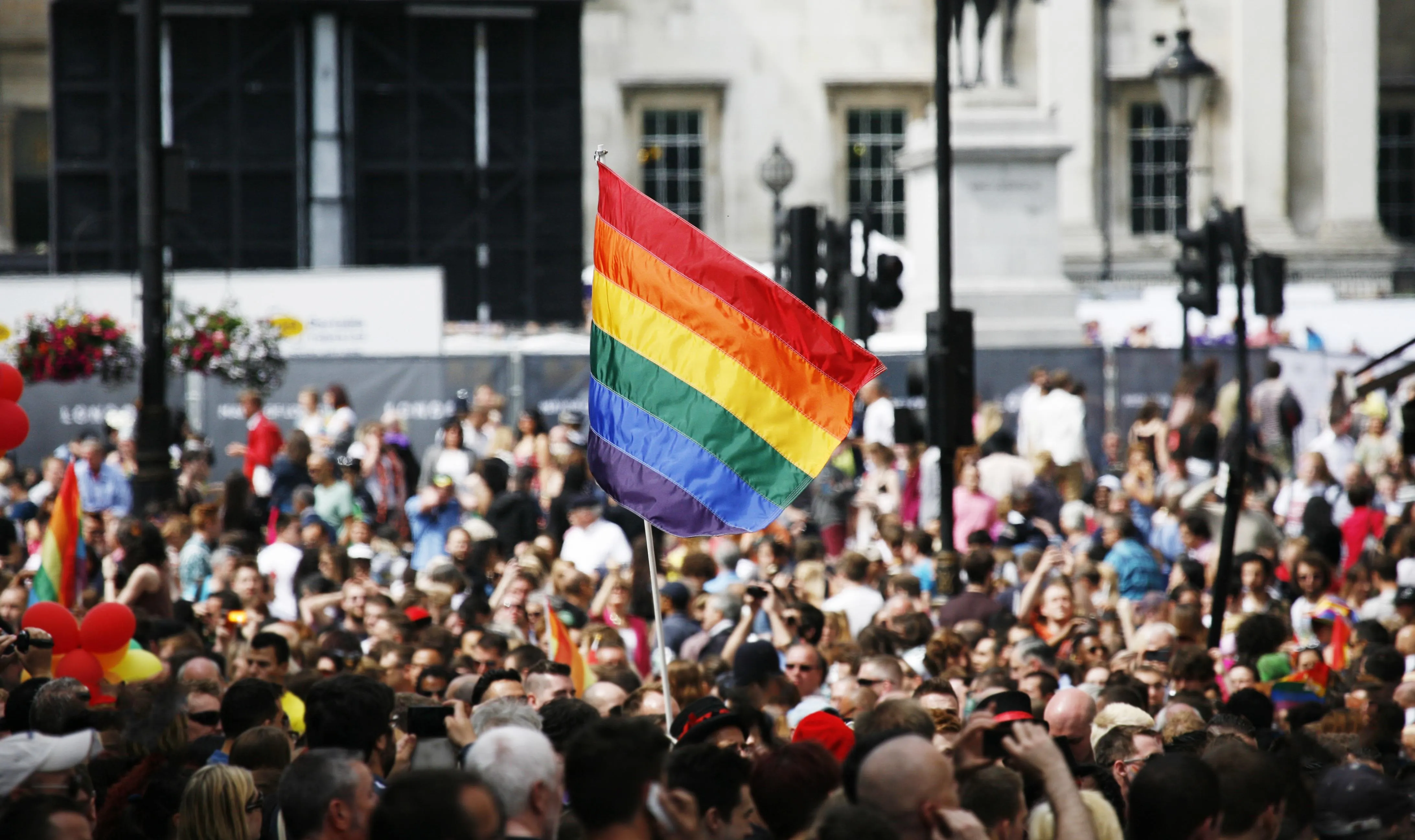 Rainbow flag waved in the crowd during London Pride.