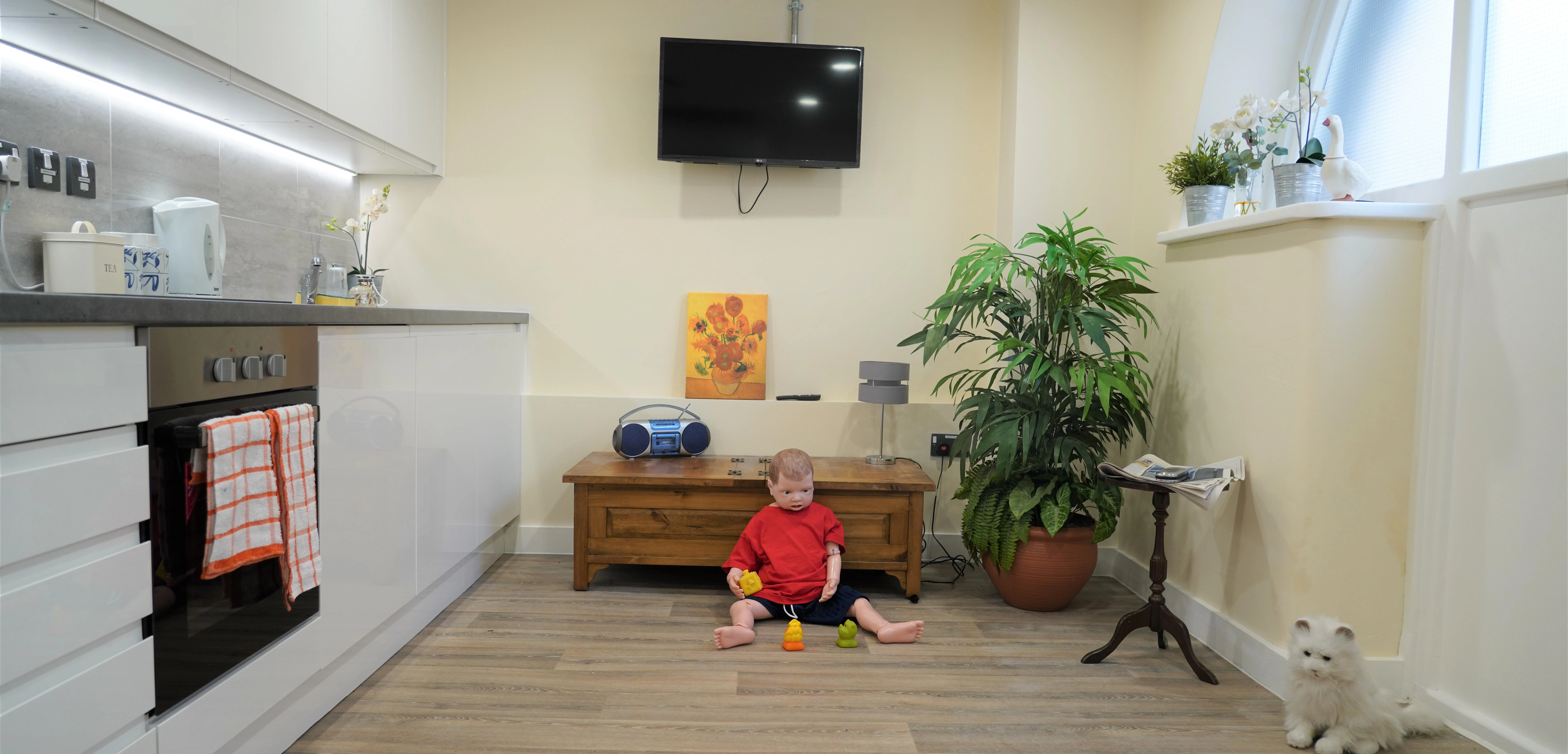 he-living-room-with-child-manikin-present