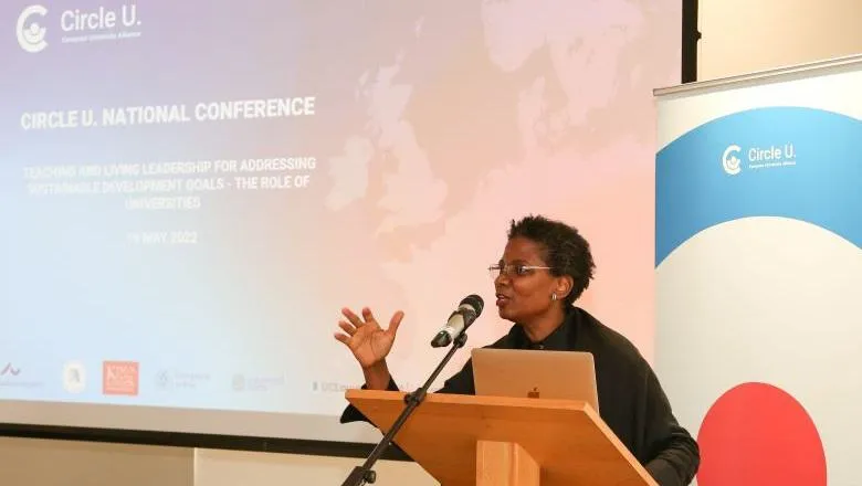 Professor 'Funmi Olonisakin speaking from a lectern