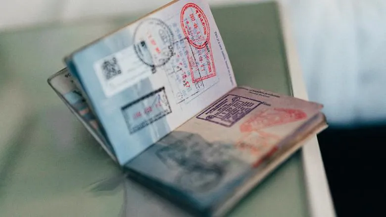 Open passport with stamped pages.
