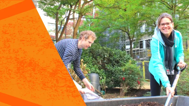 two people gardening, one is smiling at the camera