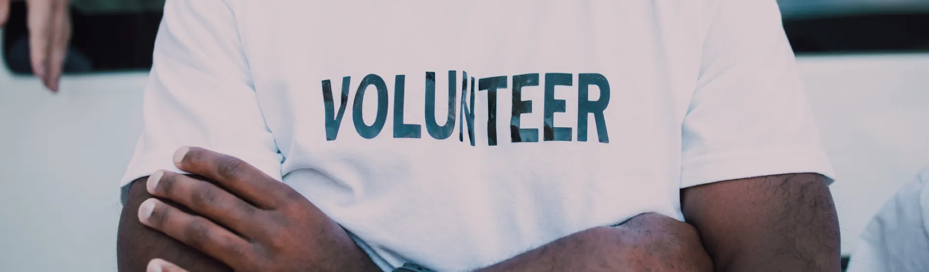 Volunteer wearing a t-shirt that reads 'VOLUNTEER'