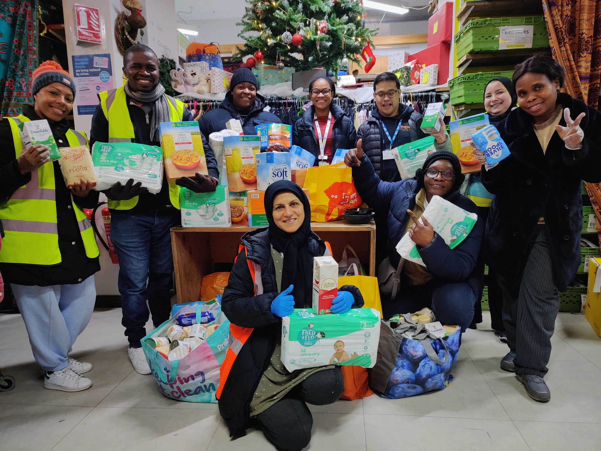A group of individuals holding donations 