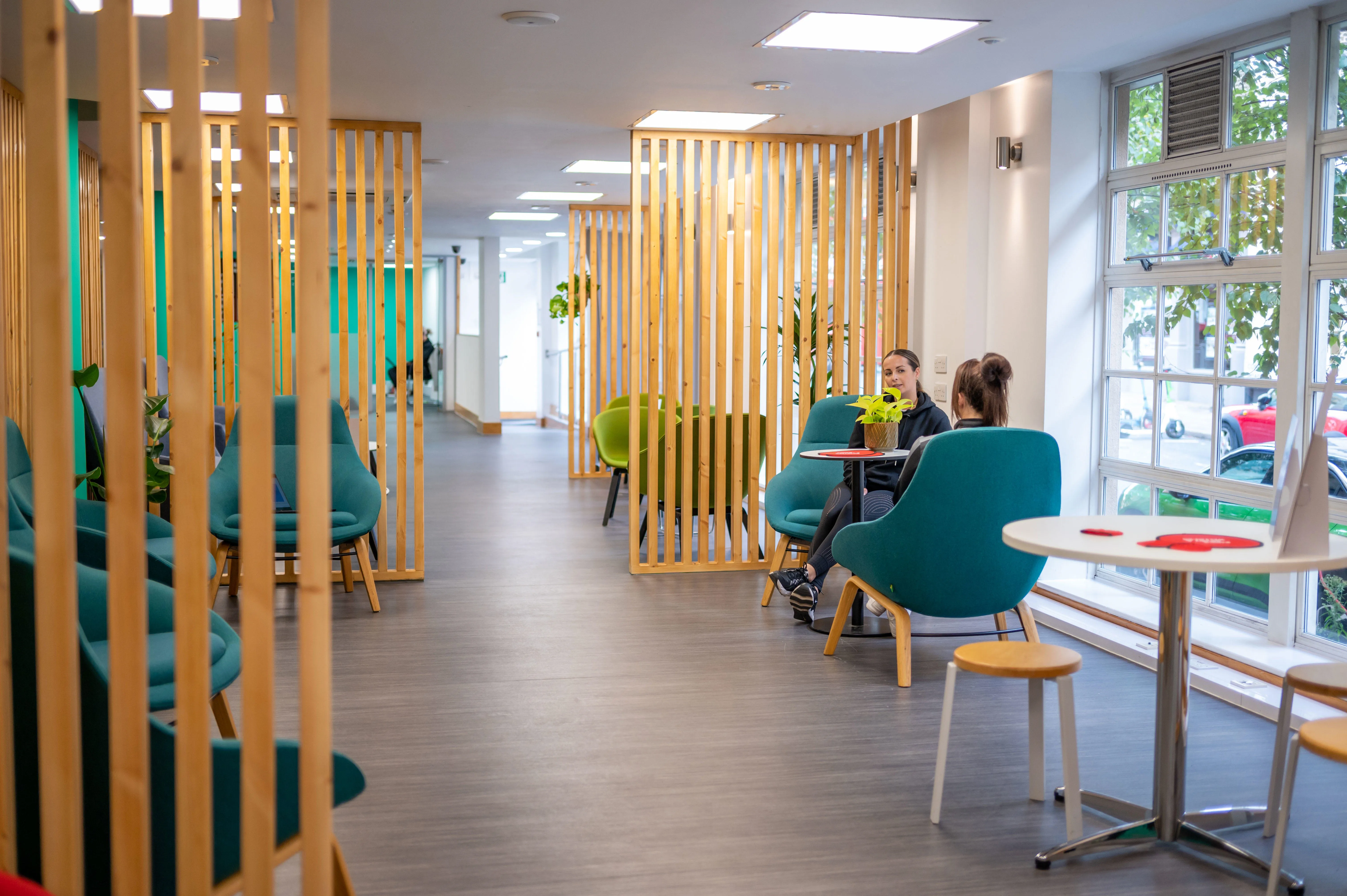 Two staff members having a meeting in the wellness centre