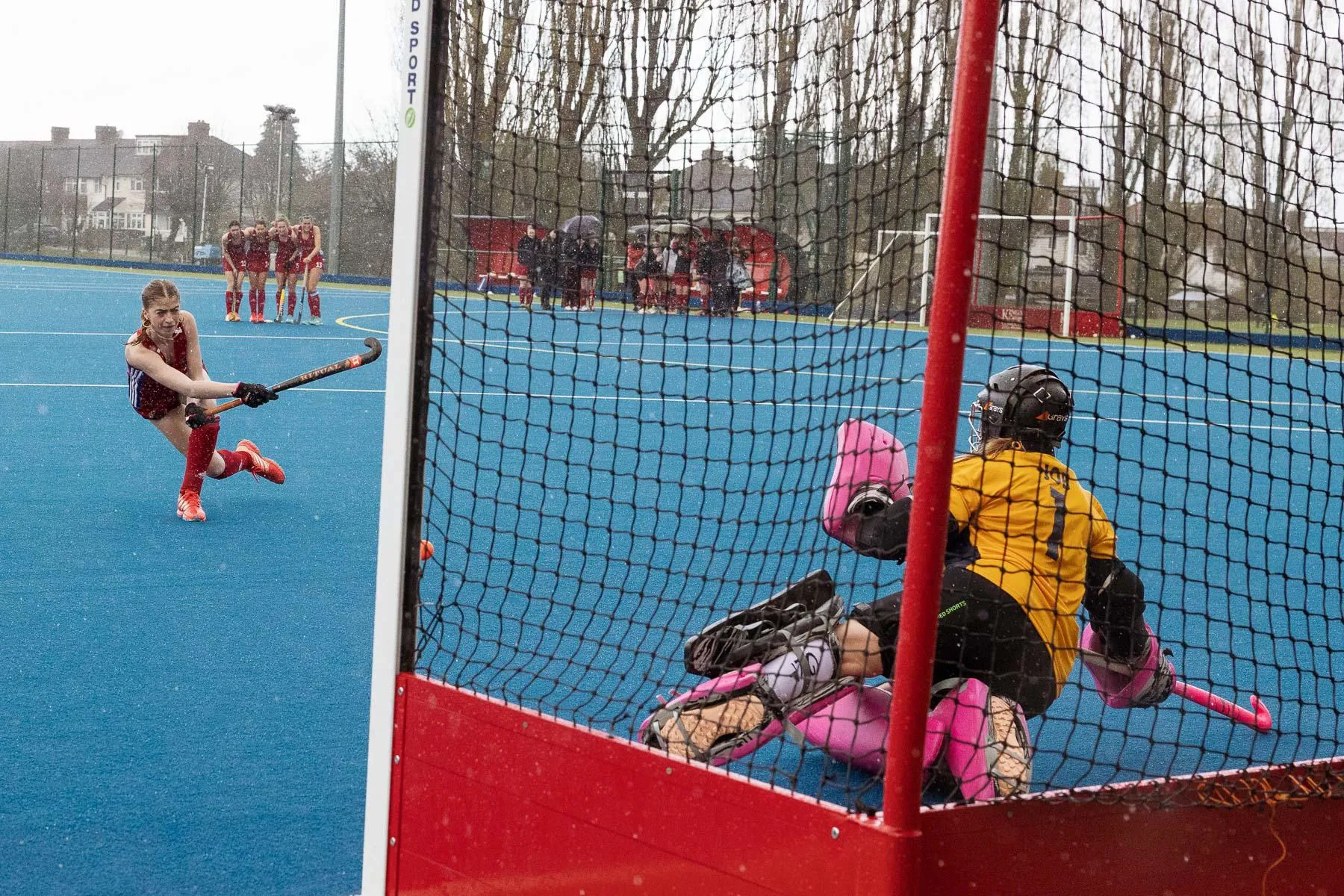 A group of women playing hockey