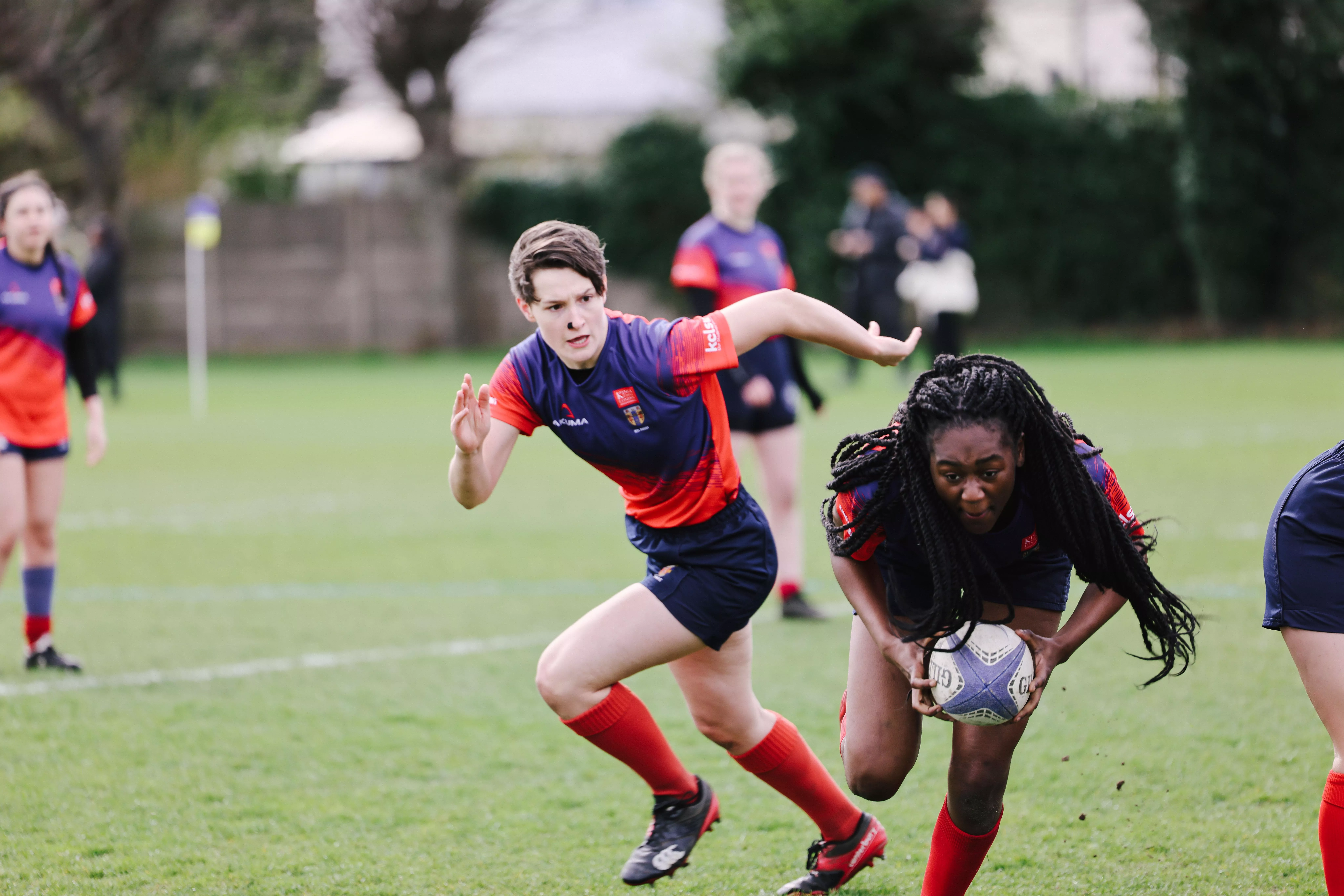 A group of women playing rugby