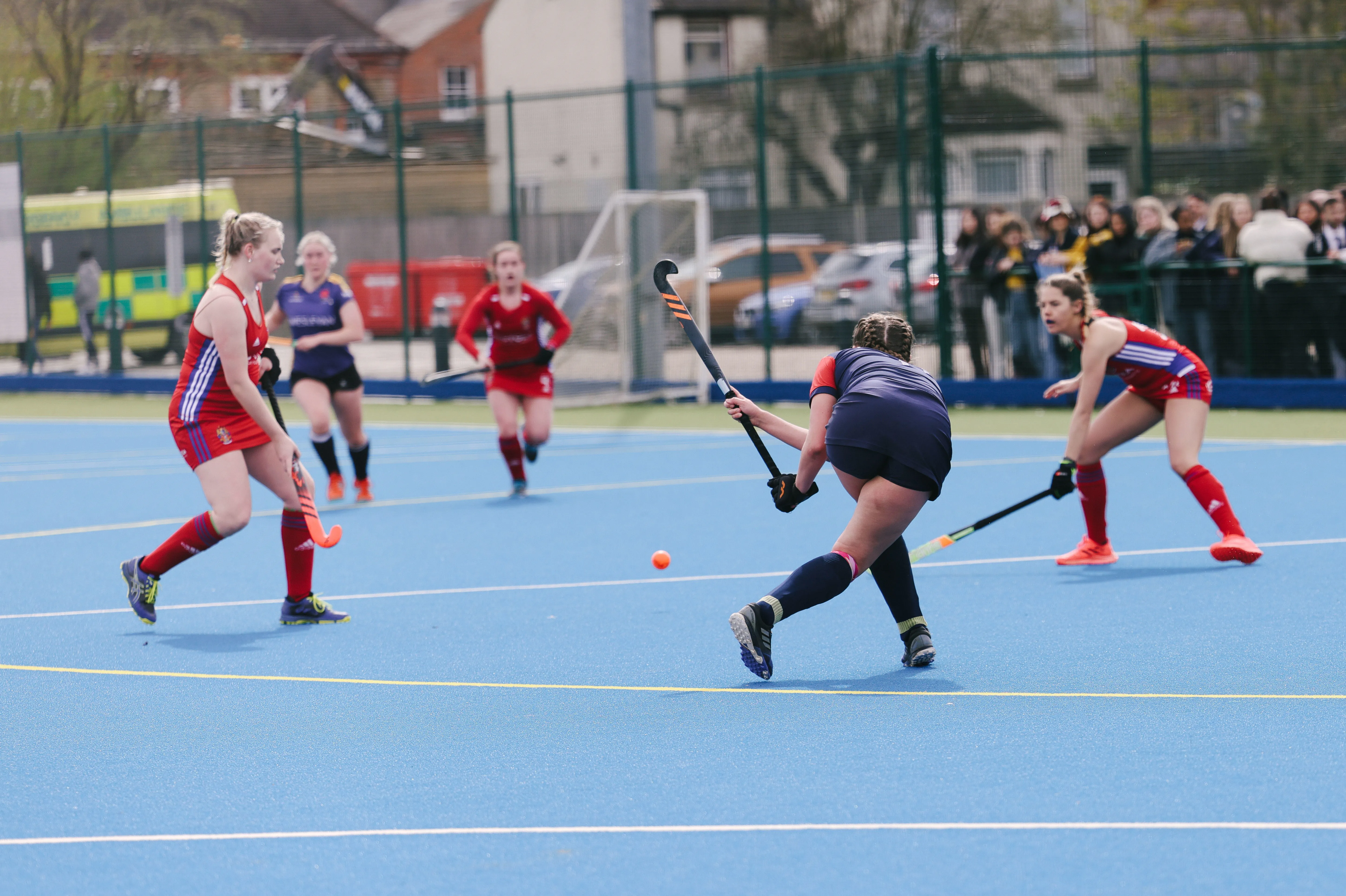 A group of women playing hockey