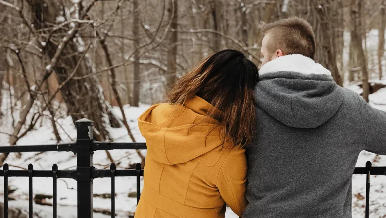 a-bridge-a-snowy-forest-and-romantic-moment thumbnail