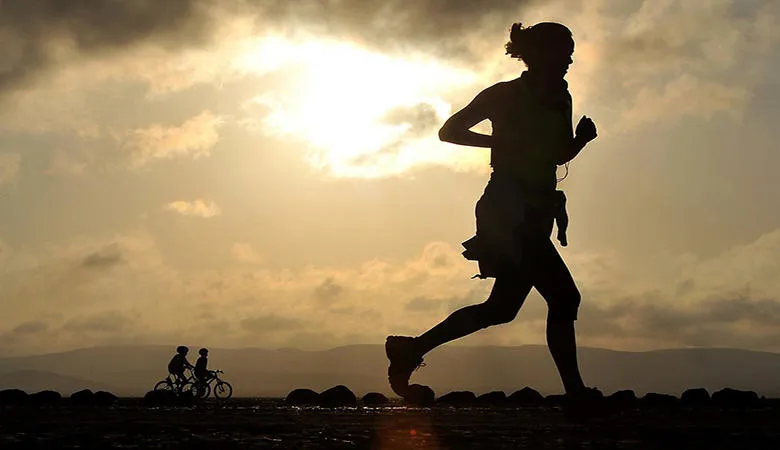 A runner at sunset
