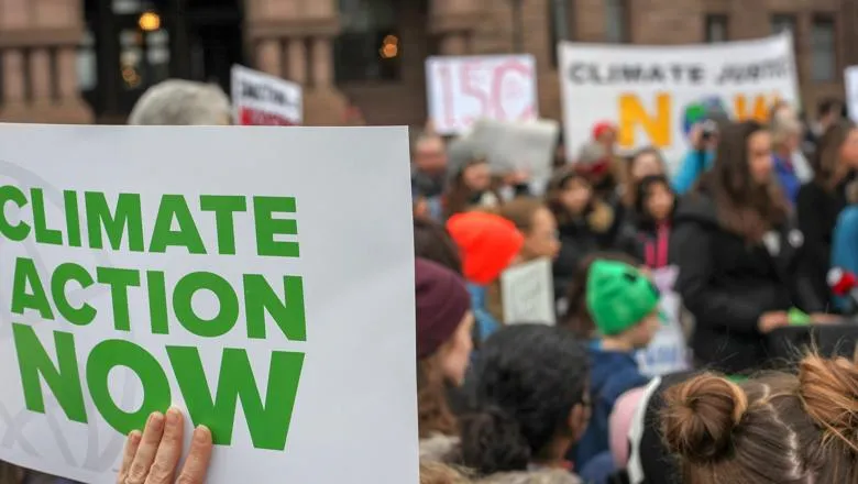 climate action sign at protest