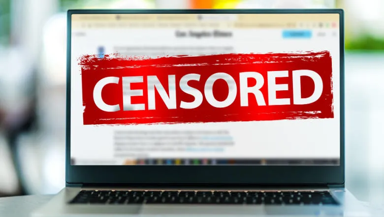 Image of a laptop screen with the word 'censored' running across 