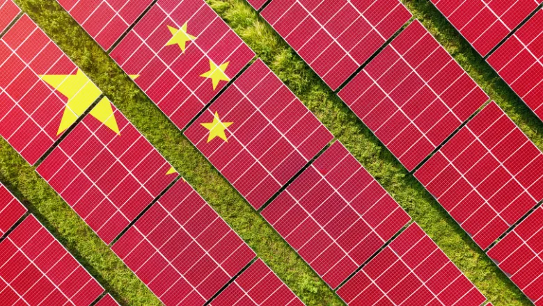 Chinese flag superimposed onto solar panels in a green field