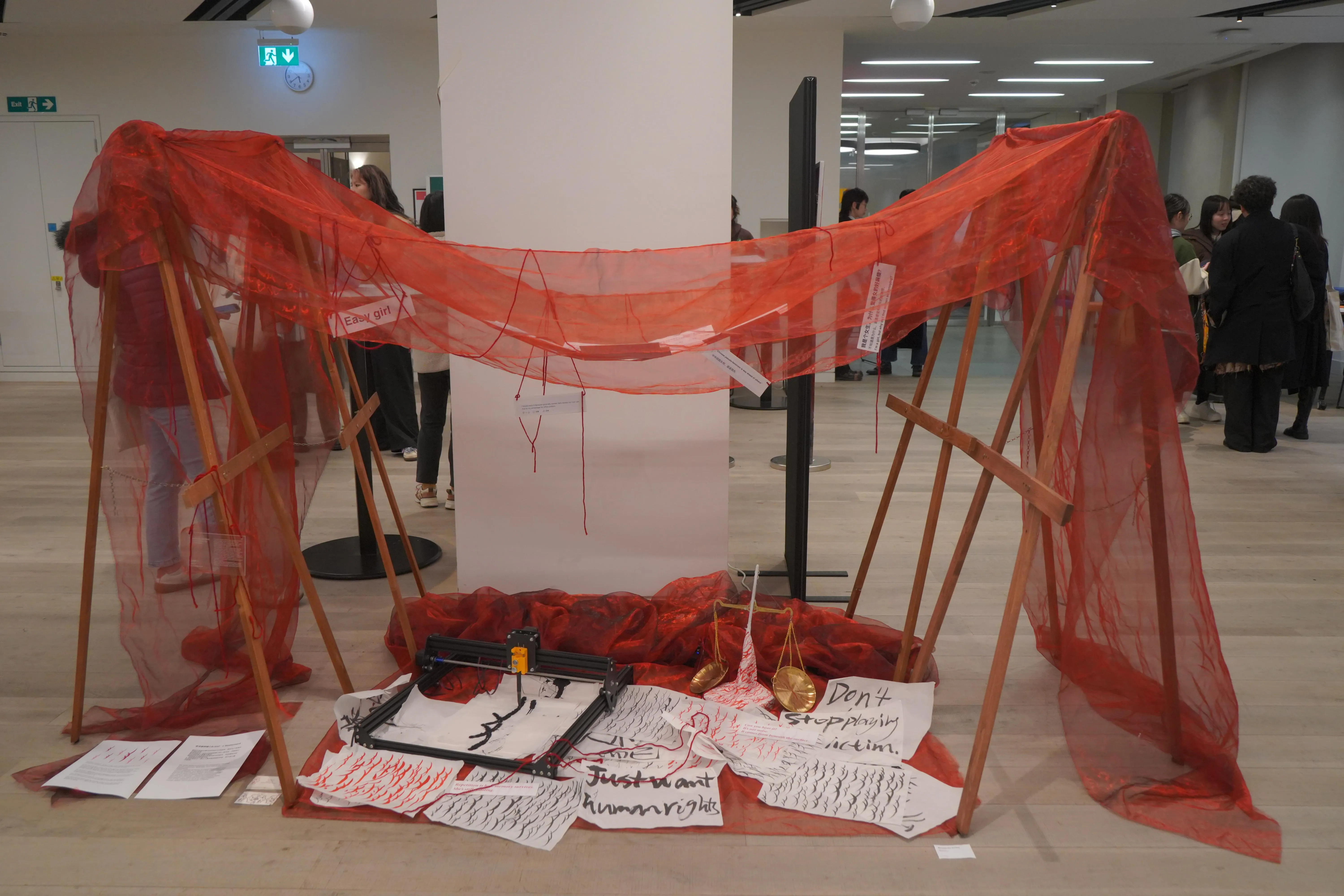 Suspended online comments partially veiled by red gauze